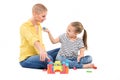 Young girl in child occupational therapy session doing sensory playful exercises with her therapist. Child therapy concept.