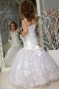 Young girl child at a wedding near the mirror