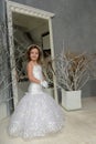 Young girl child at a wedding near the mirror