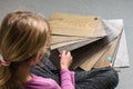 Young girl choosing vinil floor