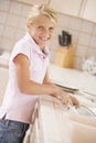 Young Girl Cleaning Dishes