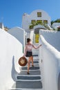 Young girl climbs stairs to building