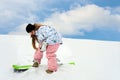 Young girl close snowboard fastering