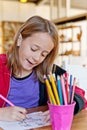 Young girl, colouring ` Royalty Free Stock Photo