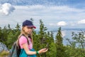 Young girl with compass on the hill top in Koli National Park Royalty Free Stock Photo
