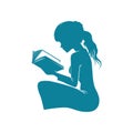 Young Girl Concentrating on a Book in Hand Royalty Free Stock Photo