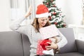 Young girl is confused with christmas gifts Royalty Free Stock Photo