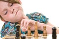 Young girl considering chess move