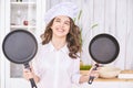 Young girl cooking kitchen. Curly pretty child portrait. Chef christmas student Royalty Free Stock Photo