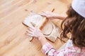 Young girl cooking at kitchen. Curly pretty child portrait. Chef student