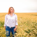 Young girl in countryside road near wheat field Royalty Free Stock Photo