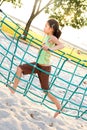 Young girl crossing the rope bridge Royalty Free Stock Photo