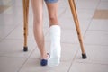 A young girl is on crutches in the corridor of the hospital Royalty Free Stock Photo