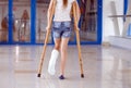 A young girl is on crutches in the corridor of the hospital. Royalty Free Stock Photo