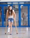 A young girl is on crutches in the corridor of the hospital Royalty Free Stock Photo