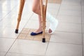 A young girl is on crutches in the corridor of the hospital. Royalty Free Stock Photo