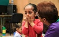 Young girl crying on her first day at school