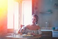 Young girl with cup of coffee or tea on greek kitchen Royalty Free Stock Photo