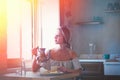 Young girl with cup of coffee or tea on greek kitchen Royalty Free Stock Photo