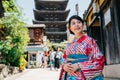 Young girl curiously looking at Japanese street Royalty Free Stock Photo