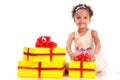 Young girl with curly hair and yellow gift box on white background Royalty Free Stock Photo