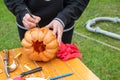 Young girl cutting a big pumpkin for Halloween Royalty Free Stock Photo