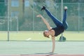 A young girl dancing breakdance on the street. Royalty Free Stock Photo