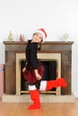 Young girl dancing in front of fireplace Royalty Free Stock Photo
