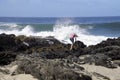 Young girl dangerously close to the edge of Thor's Well