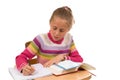 Young Girl at desk in school on white Royalty Free Stock Photo