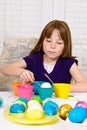 Young girl coloring Easter Eggs Royalty Free Stock Photo