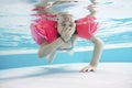 Young girl diving in the pool having fun in waterpark Royalty Free Stock Photo