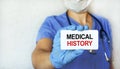 A young girl doctor holds a tablet with an inscription on a medical topic in her hand. Health care concept