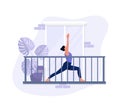 A young girl does exercises on the balcony