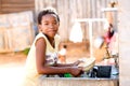 Young girl doing dishes