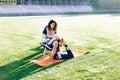 Young girl doing exercises under physiotherapist supervision. Patient Uses Physical Therapy to Recover from Surgery and