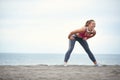 Young girl doing fitness on the beach Royalty Free Stock Photo