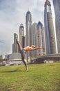 Young girl doing stretching against skyscrapers Royalty Free Stock Photo