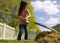 Young girl doing yardwork