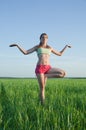 Young girl doing yoga against nature Royalty Free Stock Photo
