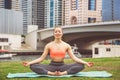 Young girl doing yoga meditation in Dubai city Royalty Free Stock Photo