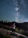 Young girl doing yoga under starry sky Royalty Free Stock Photo