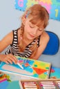 Young girl drawing a picture of family Royalty Free Stock Photo