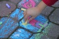 Young girl draws with the colourful chalks Royalty Free Stock Photo