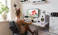 A young girl draws on a PC using a graphics tablet in her comfortable home office. Royalty Free Stock Photo