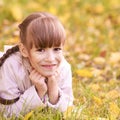 Young girl dream. Autumn background. Pretty smile