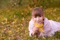 Young girl dream. Autumn background. Pretty smile