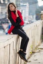 Young girl dressed in casual chinos, black sneakers Royalty Free Stock Photo