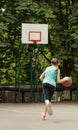 Young girl dribbling a basketball