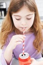 Young Girl Drinking Can Of Soda Through Straw Royalty Free Stock Photo